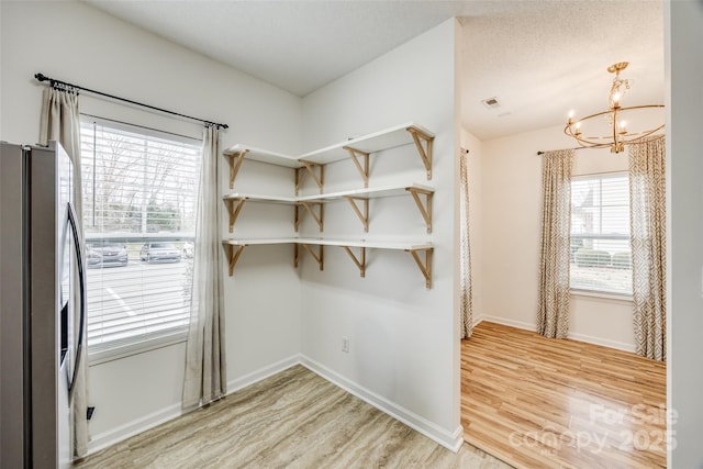 11426 Savannah Creek Dr, Charlotte, NC 28273 - interior space featuring an inviting chandelier, visible vents, and light wood-style floors