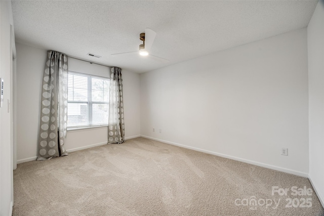 11426 Savannah Creek Dr, Charlotte, NC 28273 - empty room featuring baseboards, visible vents, ceiling fan, carpet, and a textured ceiling