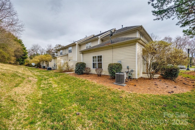 11426 Savannah Creek Dr, Charlotte, NC 28273 - back of house with cooling unit and a lawn