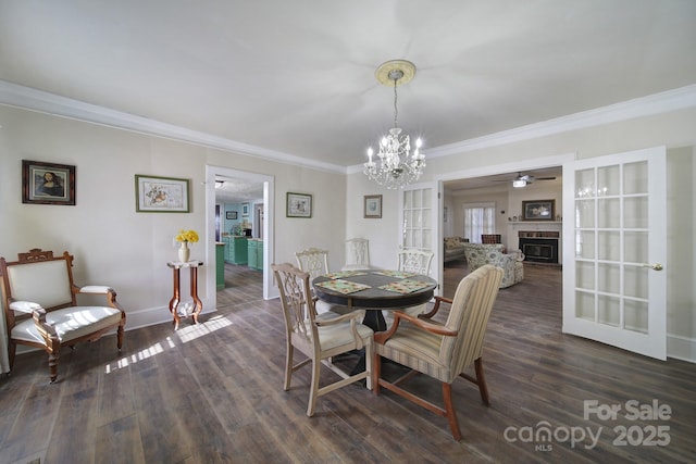 dining room with dark hardwood / wood-style flooring and ornamental molding