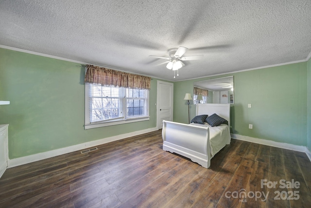 unfurnished bedroom featuring a textured ceiling, dark wood-type flooring, ceiling fan, and crown molding