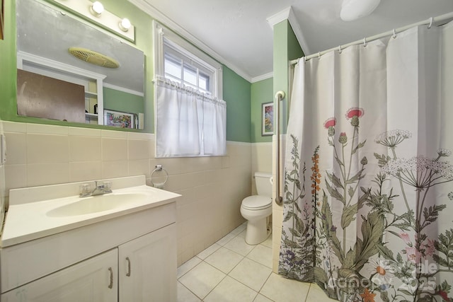 bathroom featuring tile walls, tile patterned flooring, vanity, toilet, and crown molding