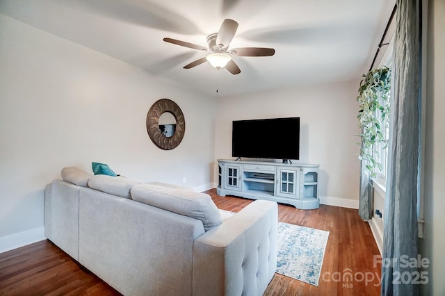 living room featuring hardwood / wood-style flooring and ceiling fan