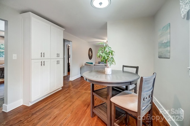 dining area featuring light wood-type flooring