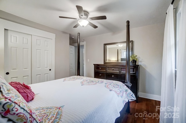 bedroom featuring dark wood-type flooring, a closet, and ceiling fan