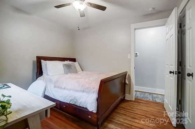 bedroom featuring hardwood / wood-style floors and ceiling fan