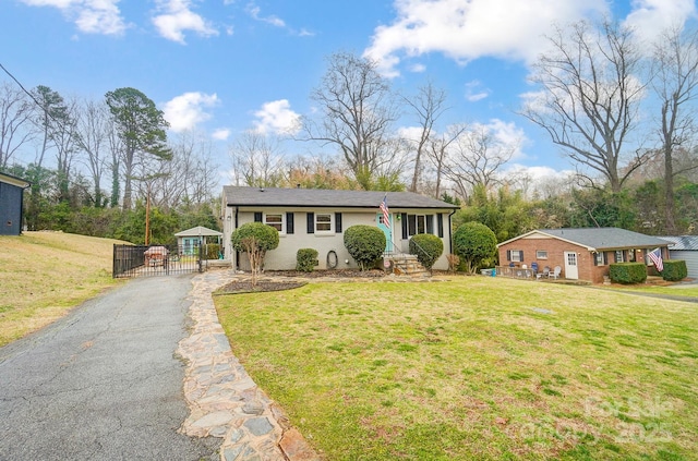 ranch-style house featuring a front lawn