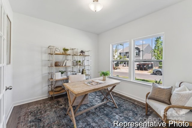 home office with dark hardwood / wood-style floors