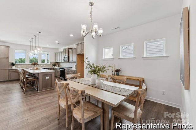 dining room with hardwood / wood-style flooring