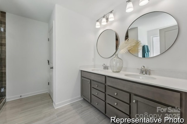 bathroom with vanity and a shower with door