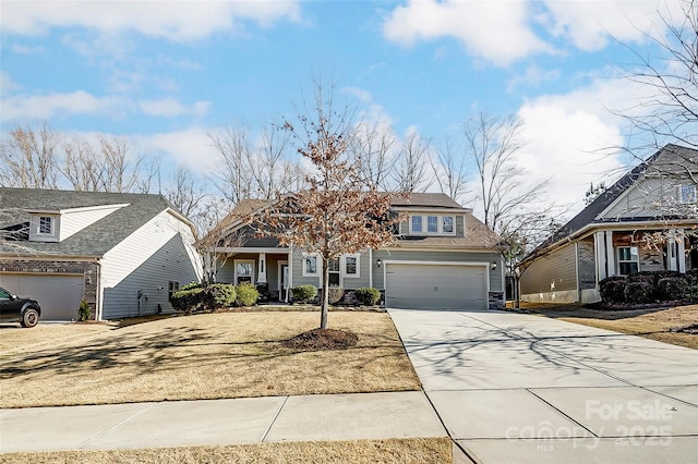 view of front facade with a garage and concrete driveway