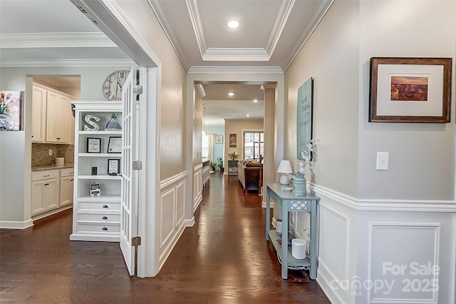 14827 Batteliere Dr, Charlotte, NC 28278 - corridor with dark wood-style floors, ornamental molding, wainscoting, and a decorative wall