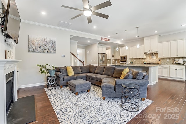 14827 Batteliere Dr, Charlotte, NC 28278 - living area featuring dark wood-style floors, visible vents, ornamental molding, and baseboards