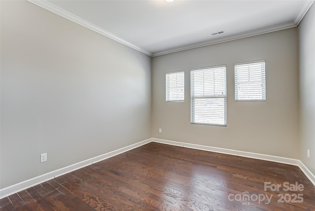 14827 Batteliere Dr, Charlotte, NC 28278 - spare room with dark wood-style floors, visible vents, baseboards, and crown molding