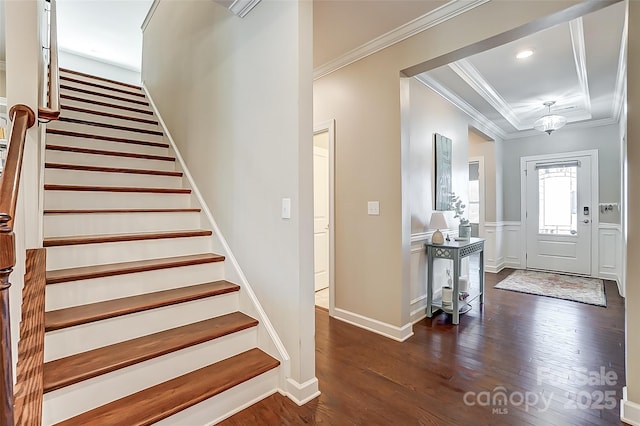 14827 Batteliere Dr, Charlotte, NC 28278 - entrance foyer featuring wainscoting, dark wood-style floors, stairs, crown molding, and recessed lighting