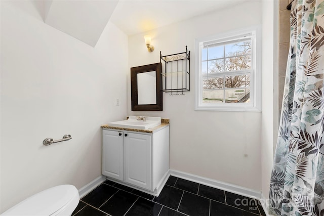 bathroom featuring vanity, tile patterned flooring, a shower with curtain, and toilet