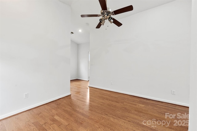 spare room featuring hardwood / wood-style flooring and ceiling fan