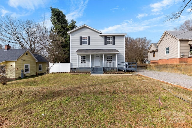 view of property with a porch and a front yard