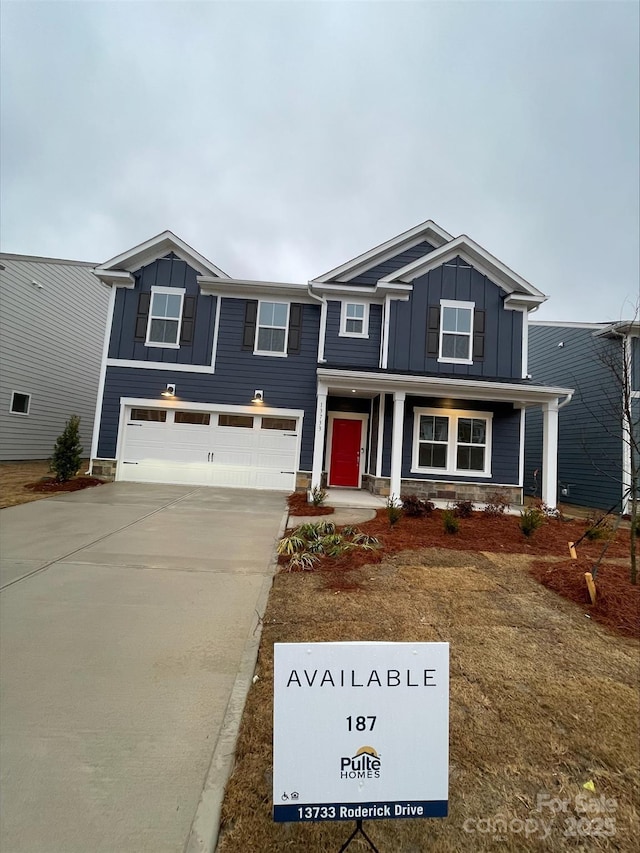 view of front of house featuring a garage and covered porch