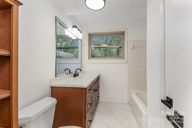 bathroom with toilet, vanity, marble finish floor, and plenty of natural light