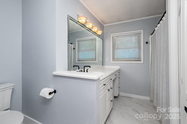 full bath with crown molding, vanity, toilet, marble finish floor, and baseboards