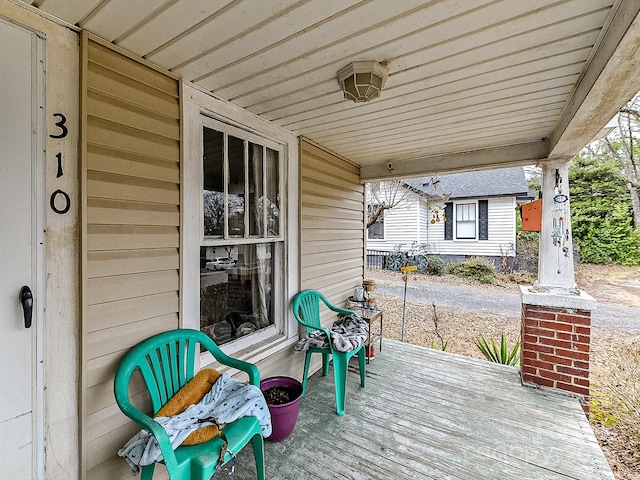 wooden deck featuring a porch