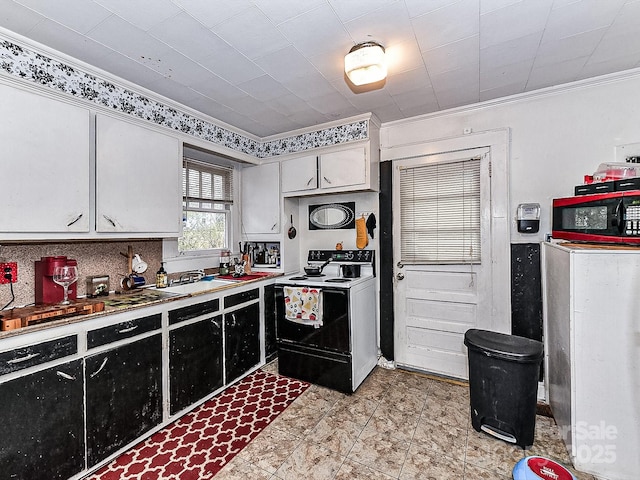 kitchen featuring white cabinetry, washer / dryer, sink, crown molding, and electric stove