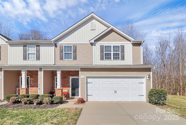 craftsman inspired home with board and batten siding, covered porch, driveway, and an attached garage