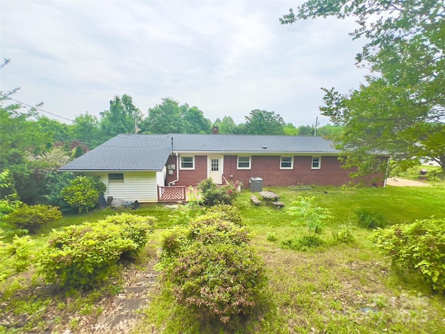 108 Meadowview Pl, Lenoir, NC 28645 - rear view of house with a chimney, a lawn, and brick siding