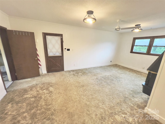 108 Meadowview Pl, Lenoir, NC 28645 - spare room with ornamental molding, carpet floors, a ceiling fan, baseboards, and a textured ceiling