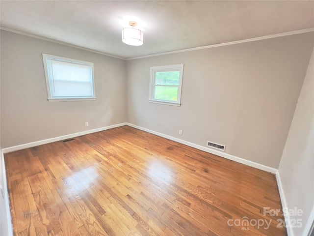 108 Meadowview Pl, Lenoir, NC 28645 - spare room with crown molding, light wood-style floors, and baseboards