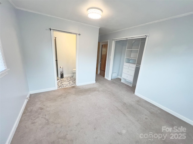 108 Meadowview Pl, Lenoir, NC 28645 - unfurnished bedroom featuring ornamental molding, carpet floors, a closet, baseboards, and connected bathroom