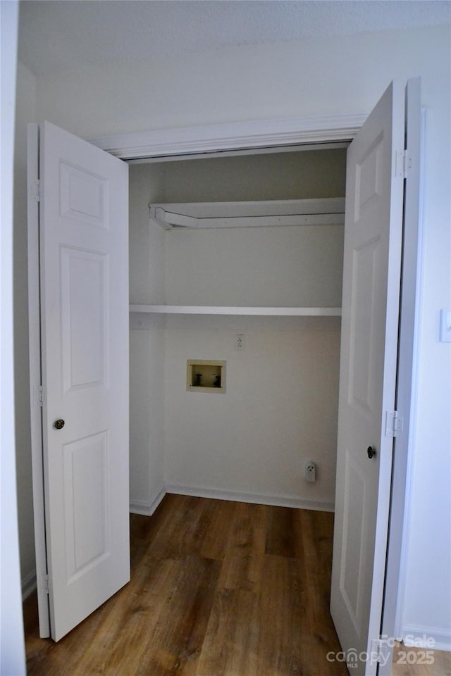 washroom featuring hookup for a washing machine and dark wood-type flooring