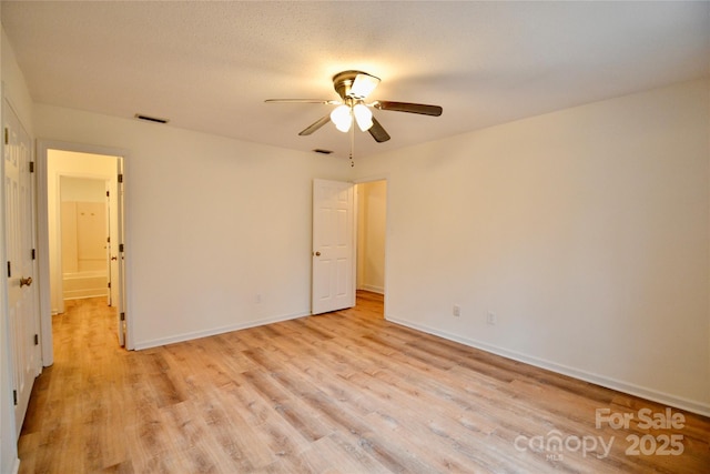 unfurnished bedroom with ceiling fan and light hardwood / wood-style flooring