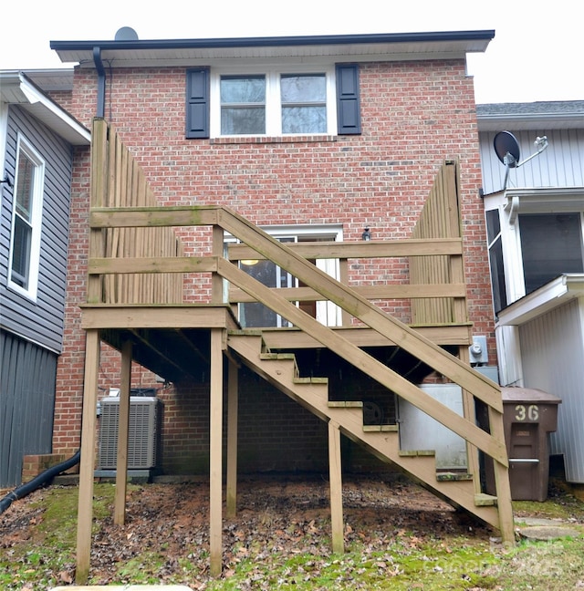 back of house with cooling unit