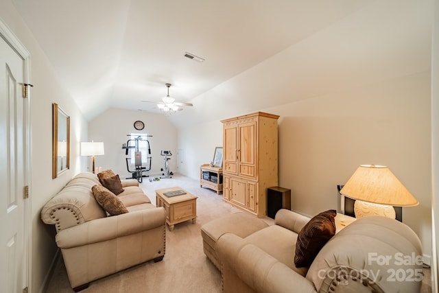 living room featuring a ceiling fan, light colored carpet, visible vents, and lofted ceiling