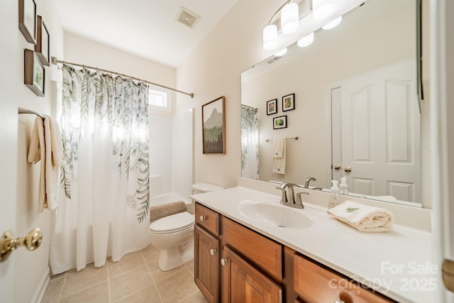 full bath featuring toilet, vanity, visible vents, tile patterned floors, and shower / bath combo