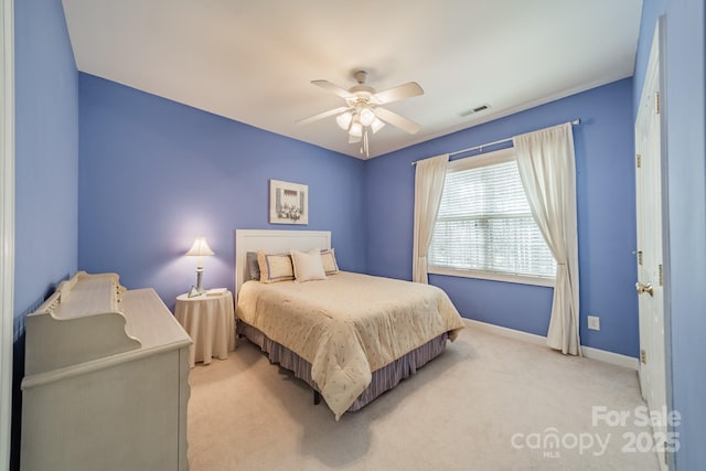 bedroom featuring baseboards, visible vents, ceiling fan, and carpet flooring