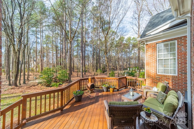 wooden deck with an outdoor living space