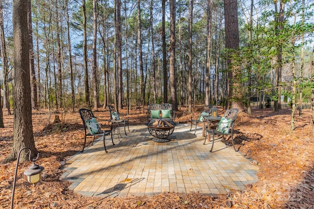 view of patio with an outdoor fire pit