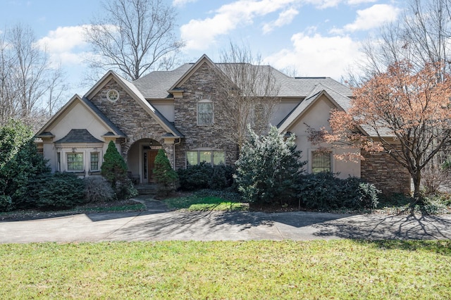 view of front of home with a front lawn