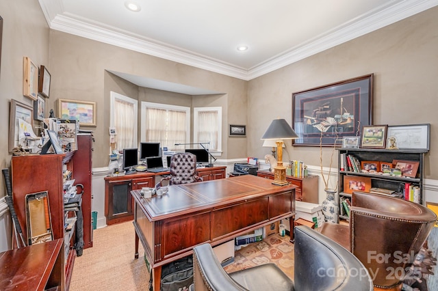 carpeted home office featuring crown molding