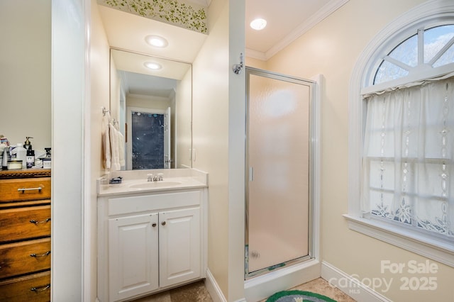 bathroom featuring ornamental molding, vanity, and walk in shower