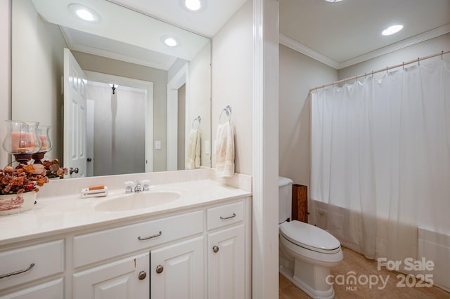 bathroom featuring ornamental molding, vanity, and toilet