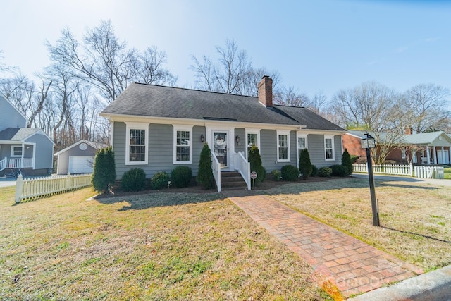 view of front of house with a garage, fence, a chimney, and a front lawn