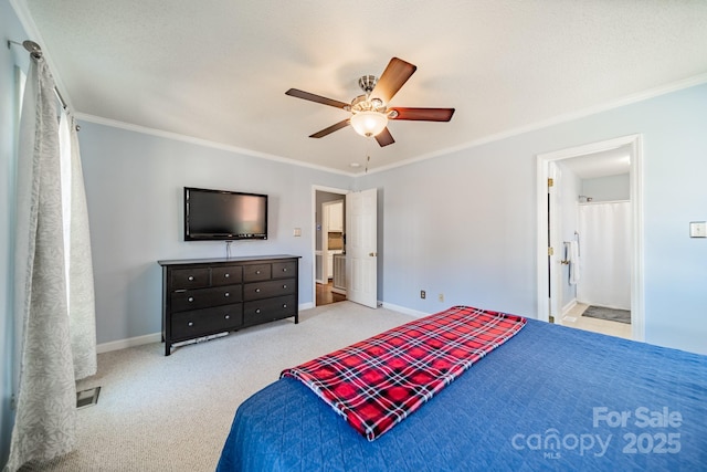 carpeted bedroom with ornamental molding, baseboards, and a ceiling fan