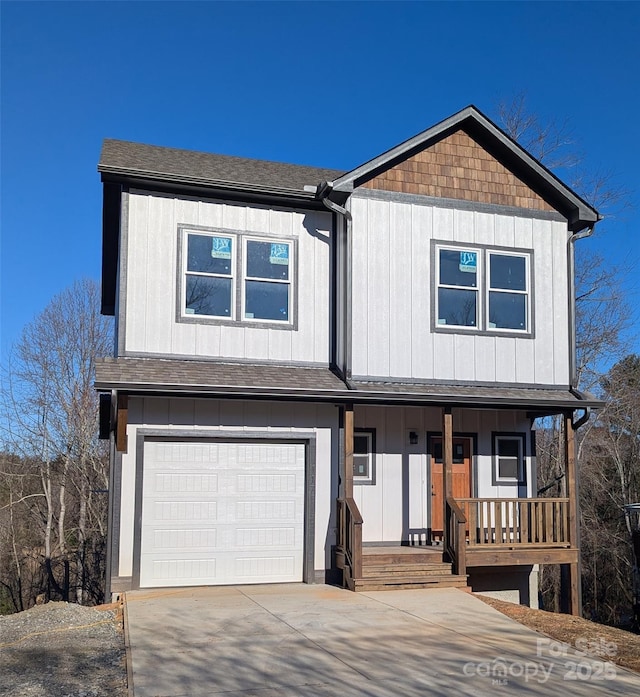 view of front of house featuring a garage, a porch, driveway, and roof with shingles