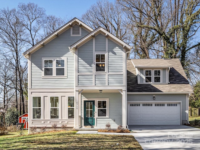 view of front facade with a garage and a front yard