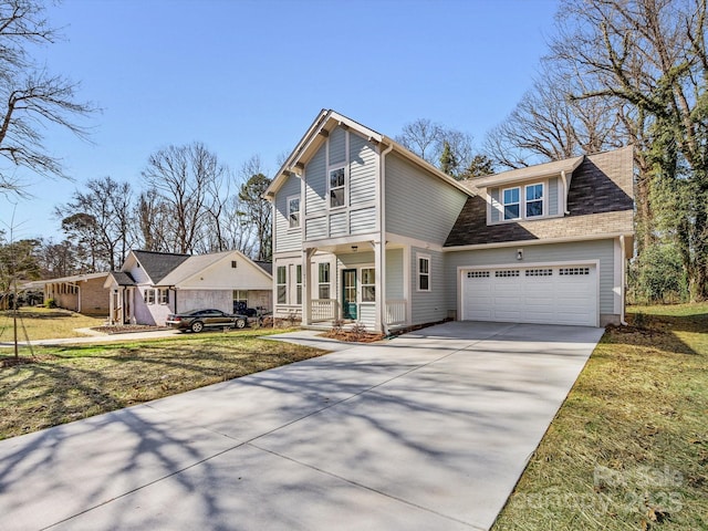 view of front of home featuring a garage and a front lawn