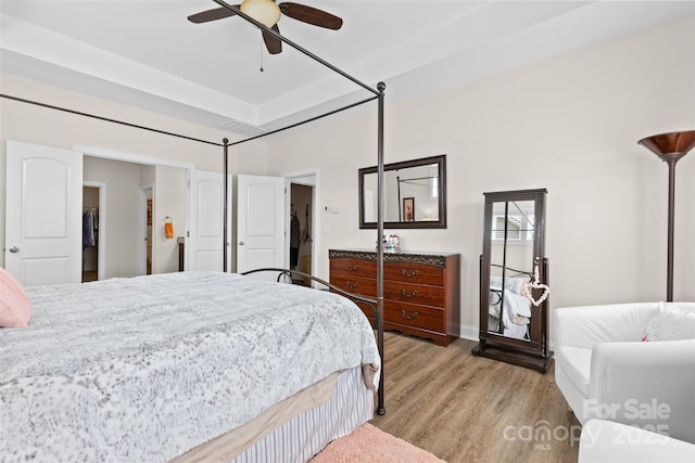 bedroom with ceiling fan and light wood finished floors